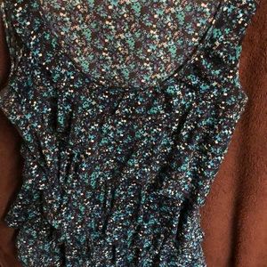 Ruffled sleeveless top.